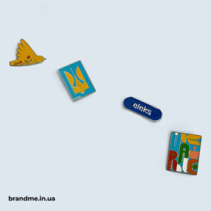 Металеві значки з айдентикою компанії Eleks