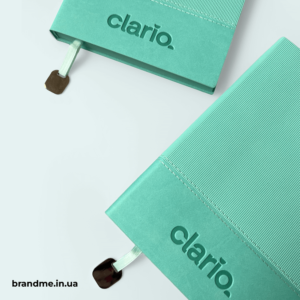 Брендовані мʼятні блокноти з тисненням логотипа Clario