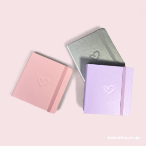 Кольорові блокноти з тисненням Рожевий, срібний та бузковий блокноти з тисненням у вигляді серця на обкладинці